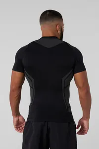 Back view of men's black compression fitness t-shirt showing muscle-highlighting seams