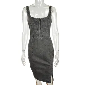 Close-up of grey acid wash denim dress with corset stitching and front zip