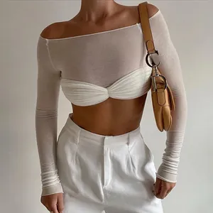 Detail of an elegant white off-the-shoulder long sleeve sheer crop top for women