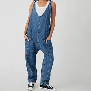 Full view of V-neck denim overalls with deep pockets and relaxed harem style silhouette