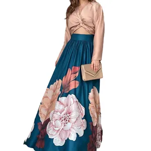 Two-piece floral print maxi skirt and long sleeve crop top set for vacation fashion