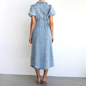 Back view of a puff sleeve light blue denim midi dress with cinched waist design