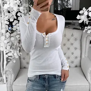 Detail view of white ribbed slim-fit T-shirt with scoop neck and button decoration