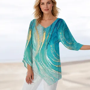 Dames tuniek met V-hals en abstracte marmerprint in blauw en goud met lange mouwen
