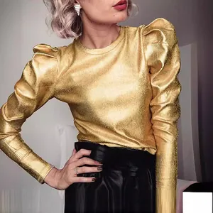 Detail of gold metallic punk style t-shirt with puff shoulders and ribbed texture