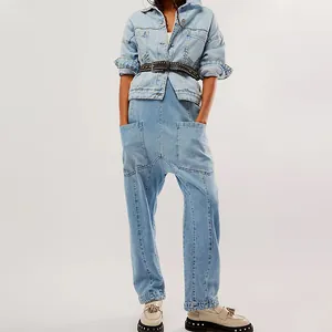 Full view of light blue denim jumpsuit with large pockets and stylish wash