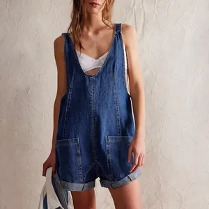 Detail view of a stylish blue washed denim short jumpsuit with adjustable straps