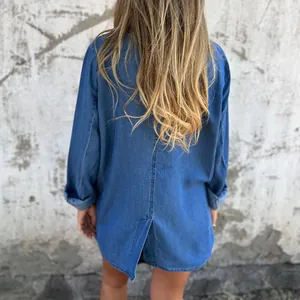 Back view of women's casual loose long-sleeve denim jacket with back split hem detail