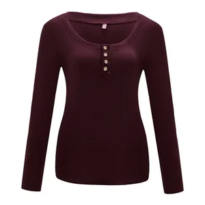 Detailed view of women's burgundy ribbed U-neck t-shirt with four-button front design