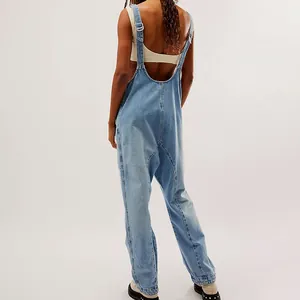 Back view of light blue adjustable denim overalls with a loose fit and V-neck design