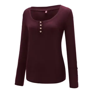 Detailed view of women's burgundy U-neck ribbed knit top with four decorative buttons