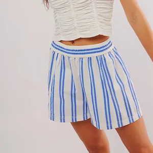 Detailed close-up view of women's casual beach shorts with blue and white vertical stripes