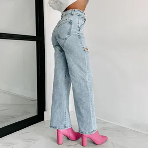 Detailed side view of light blue straight-leg jeans featuring rhinestone cut-out accents
