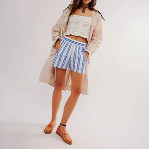 Full outfit view of blue striped summer shorts with pockets on a fashion model
