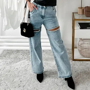 Stylish light blue straight-leg distressed jeans with sparkling rhinestone knee cutouts