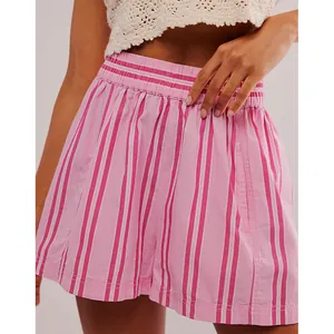 Detail shot of pink and white striped summer shorts featuring elastic waistband and pocket