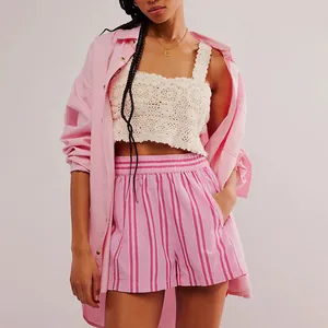 Detail view of pink and white striped beach shorts featuring a comfy elastic waist