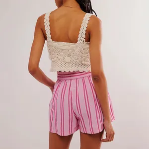 Back view of women's pink striped beach shorts with elastic waist and relaxed fit