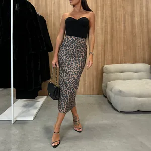 Chic leopard print high waisted PU leather midi skirt featuring an elegant slim fit