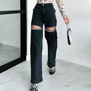 High-waisted distressed black straight-leg jeans with rhinestone knee cut-outs