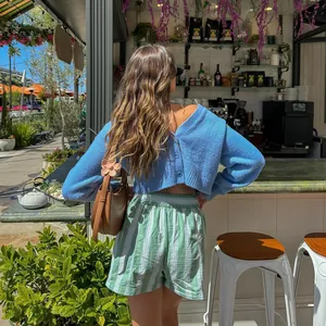 Casual green striped beach shorts with elastic waist for a stylish summer vacation look