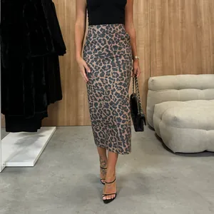 Detail view of a stylish leopard print high-waisted PU skirt on a fashion model
