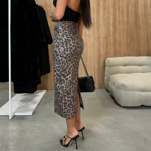 Detailed side view of leopard print high-waist PU leather midi skirt with slit
