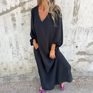 Elegant black loose-fitting maxi dress with a deep V-neck and stylish lantern sleeves