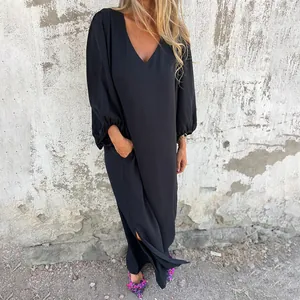 Detailed side view of a black loose V-neck maxi dress with stylish lantern sleeves.