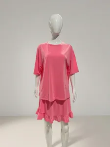 Comfortable pink two-piece loungewear set featuring a loose T-shirt and ruffle shorts
