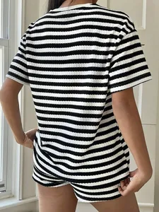 Rear view of women's casual loose fit black and white striped short sleeve T-shirt set