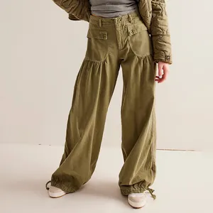 Close-up of women's olive green wide-leg cargo pants with gathered pockets and drawstring hem.