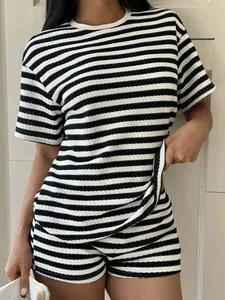 Close-up of the textured horizontal striped fabric on a casual women's summer set