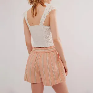 Detailed back view of women's orange striped summer beach shorts with comfortable elastic waist