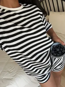 Close-up detail of women's casual black and white striped T-shirt and shorts set