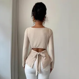 Chic ribbed knit long sleeve top featuring back cutout and bow tie detail