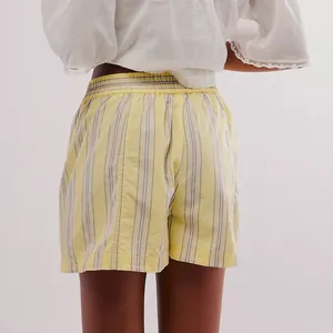 Back view of yellow striped summer shorts featuring a comfortable elastic waistband