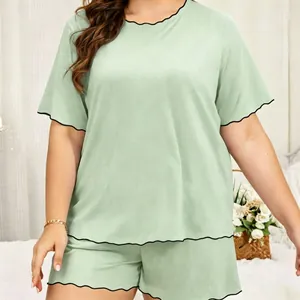 Detailed view of women plus size mint green pajama set with decorative wavy lettuce edge trim