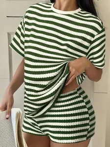 Close-up of green and white striped waffle knit summer t-shirt and shorts lounge set.