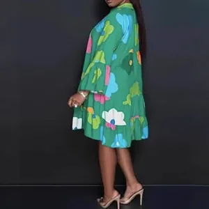 Stylish loose-fit green floral print mini dress with long sleeves and flared hemline