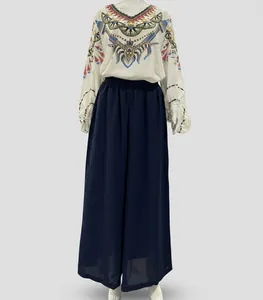 Bohemian patterned long-sleeve top and navy blue wide-leg beach pants set display