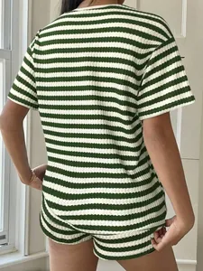 Detailed back view of a women's green and white striped knit lounge set with a relaxed fit