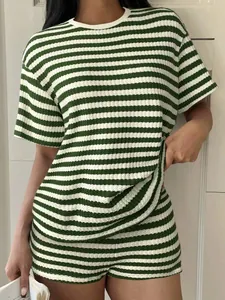 Macro view showing the texture of green and white striped summer loungewear set for women