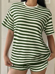 Detail showing the green and white striped knit texture on this summer casual T-shirt set