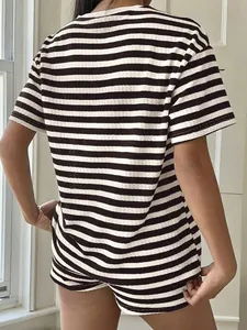 Back view of women's vintage style black and white striped t-shirt and shorts set