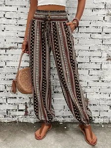 Bohemian ethnic print harem pants featuring a smocked high waist and elastic cuffs