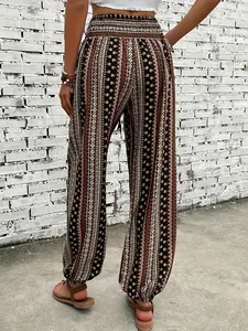 Back view of bohemian ethnic print harem pants with smocked waist and elastic cuffs