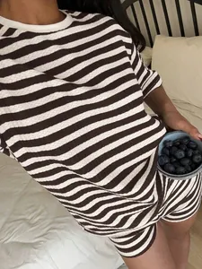 Close-up detail of women's vintage brown and white striped lounge set with loose fit