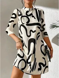 Detailed view of stylish white mini dress featuring abstract black graphic print patterns