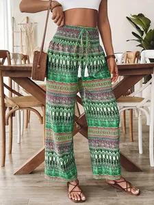 Pantalon bohème à imprimé vert, taille haute élastique et cordons à glands blancs